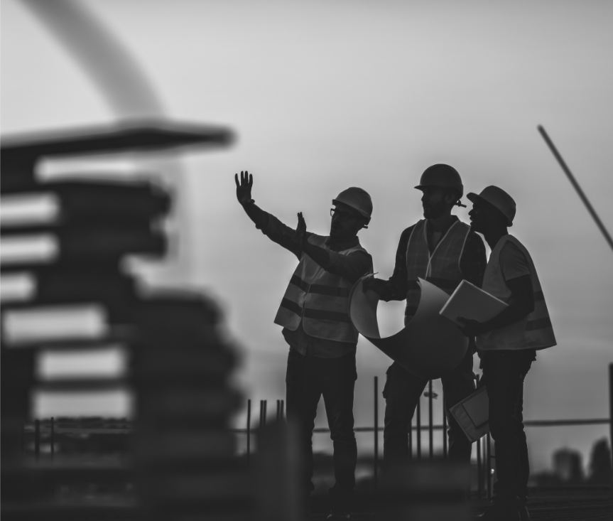 workers collaborating at a construction site.