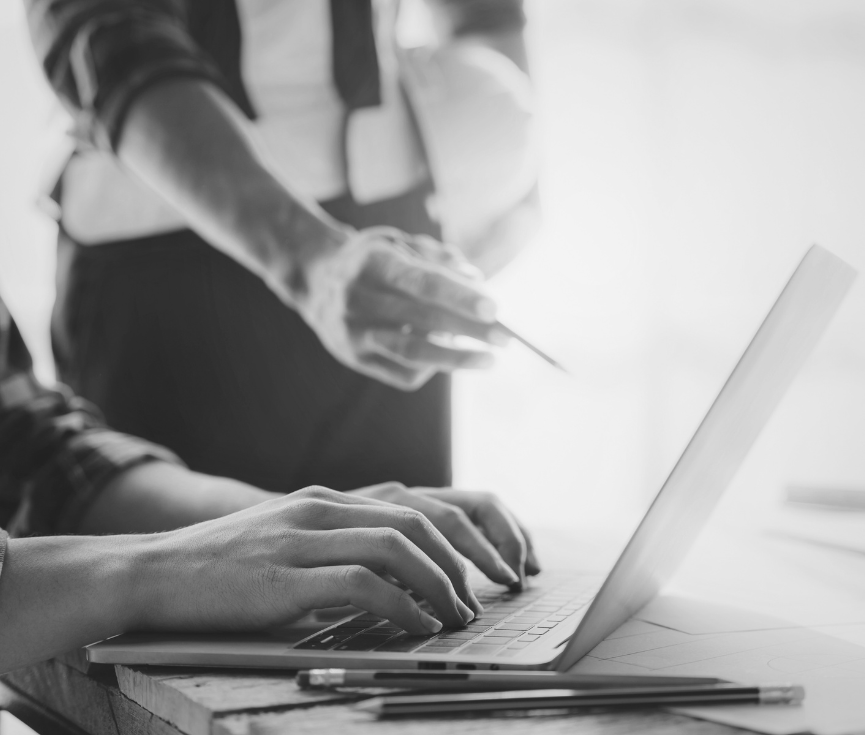 hands typing on laptop