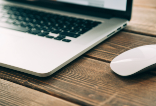 Laptop Computer and mouse on a desktop